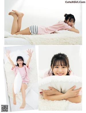 a woman laying on top of a blanket in a field