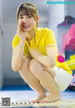 A magazine with a picture of a woman smiling.