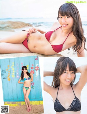 a woman in a blue bikini sitting on a towel on the beach